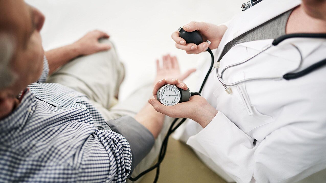 Cardiologists measure blood pressure for patients with signs of hypertension